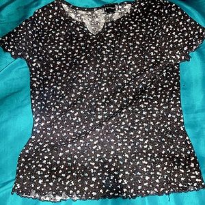 This is a shirt black and white with flowers